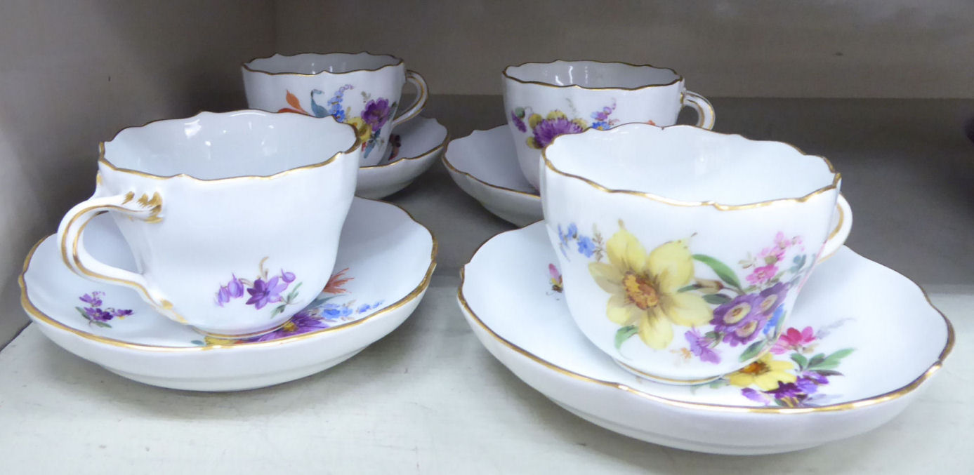 A set of four early 20thC Meissen porcelain coffee cups and saucers,