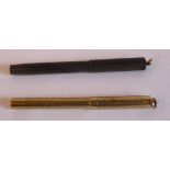 A lady's 'vintage' 14ct gold cased dip pen with engine turned part decoration and a suspension ring