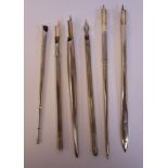 Six various 'vintage' silver/silver coloured metal dip pens, having push nib fittings, viz.