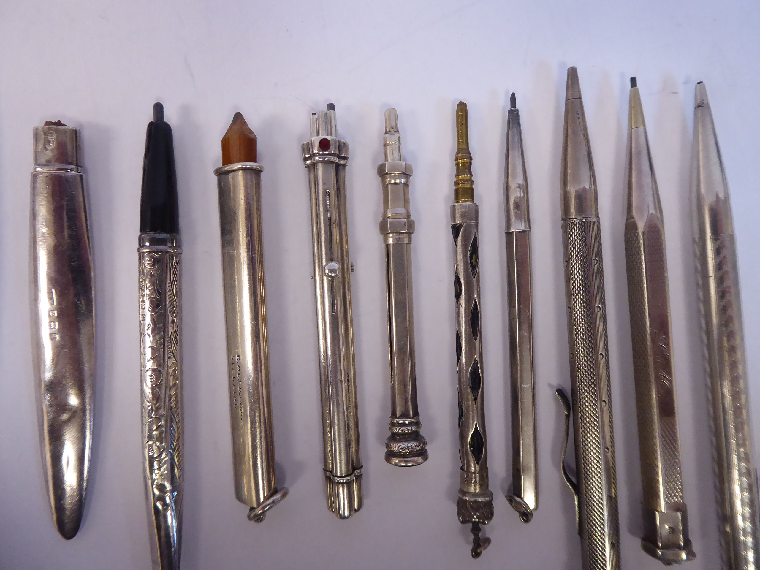 Ten items of 'vintage' silver, silver coloured and white metal cased writing equipment, viz. - Image 3 of 8