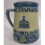 A Moorcroft pale blue and green glazed pottery commemorative mug of tapered form,