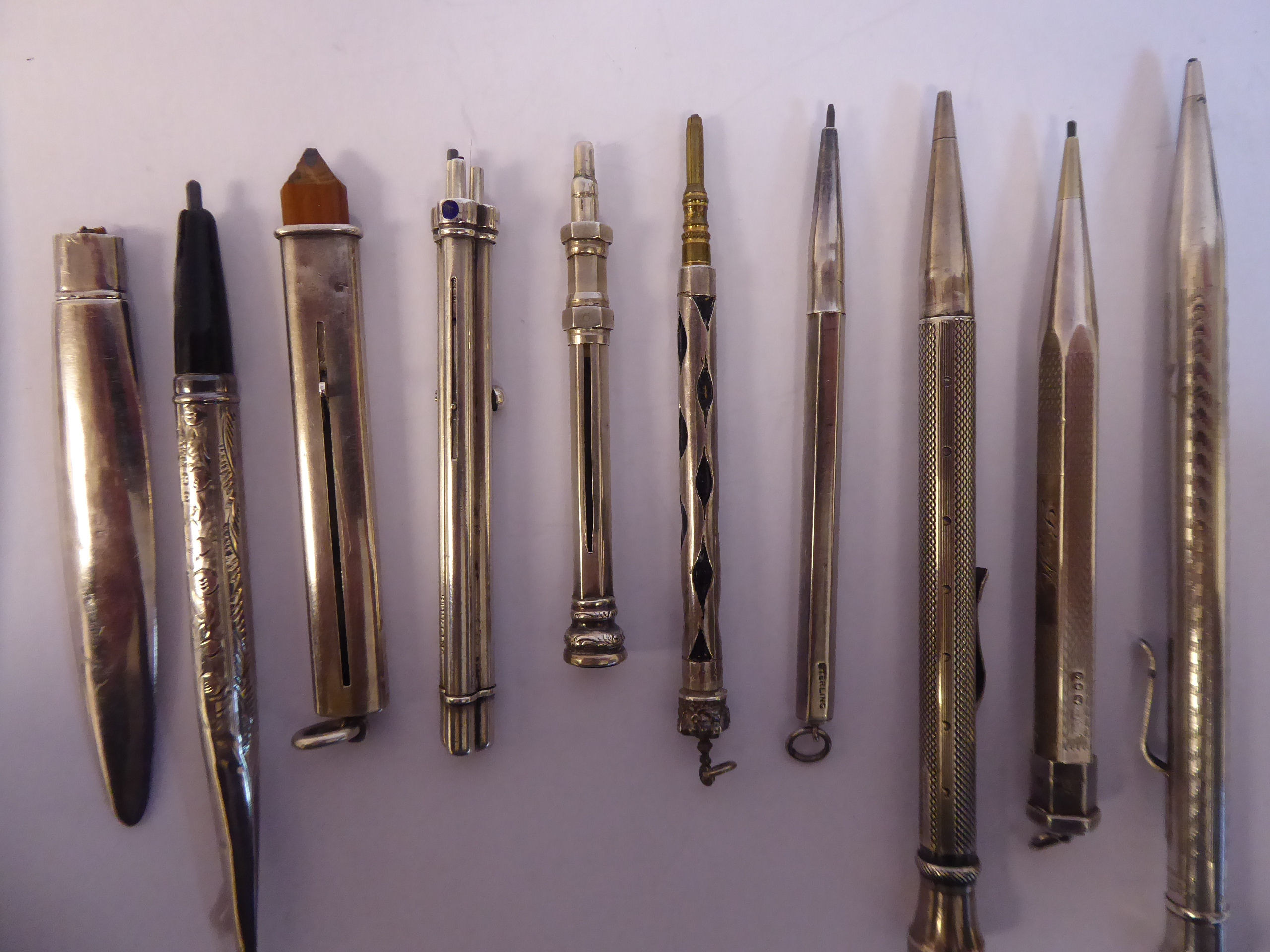 Ten items of 'vintage' silver, silver coloured and white metal cased writing equipment, viz. - Image 2 of 8