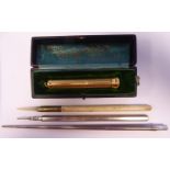 A 'vintage' white metal propelling pencil, in an hexagonal holder; another of slender,