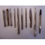 Ten items of 'vintage' silver, silver coloured and white metal cased writing equipment, viz.