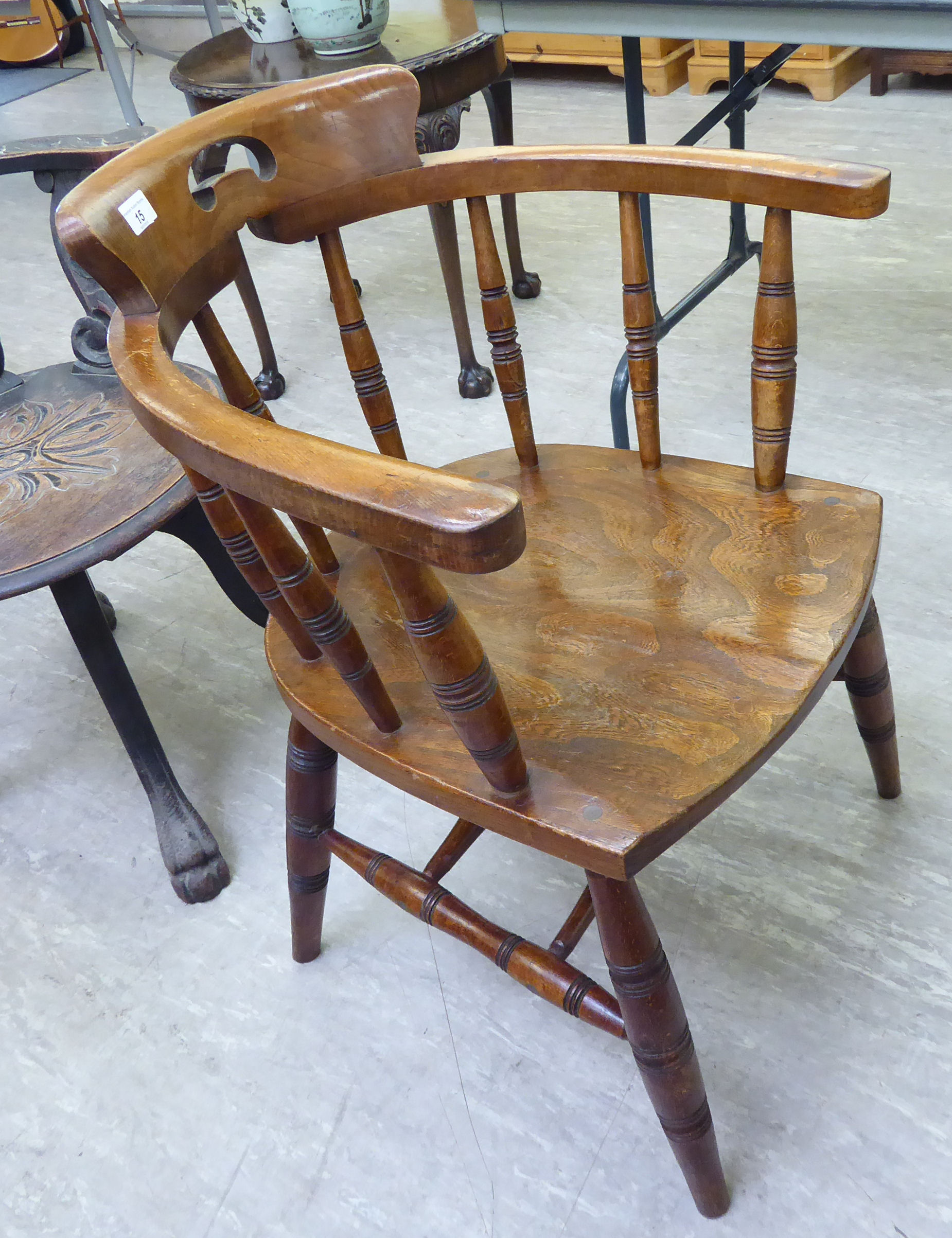 An early 20thC beech and elm framed captain's chair with a spindled back, - Image 2 of 2