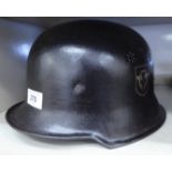 A World War II German Fire Police helmet, bears a printed label HMA,