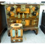 A 20thC Chinese cabinet of mixed woods with rivetted brass mounts and fittings,