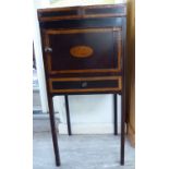 A George III satinwood inlaid mahogany washstand with a double opening top, a door and a drawer,