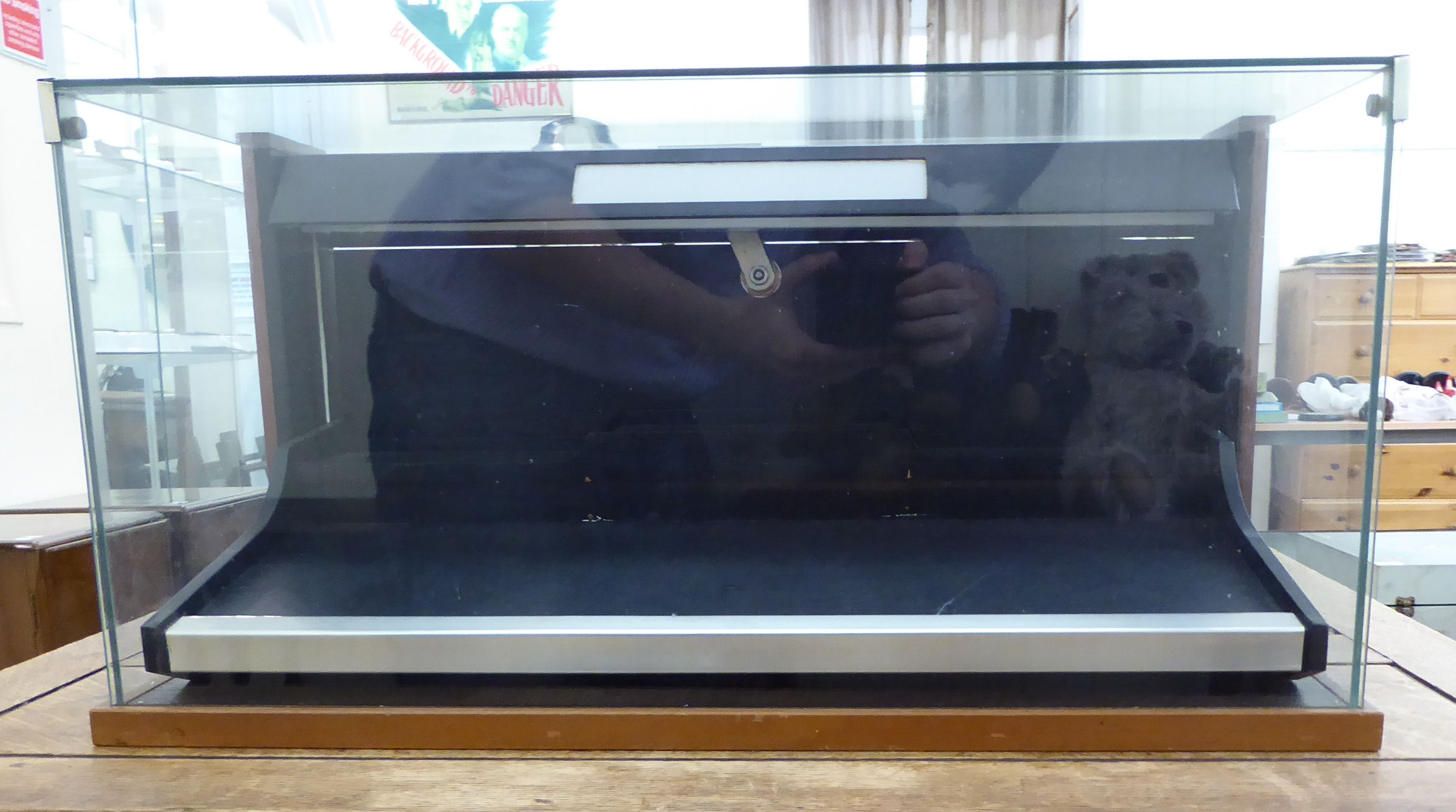A modern retailer's partially glazed table top display cabinet 11''h 22.