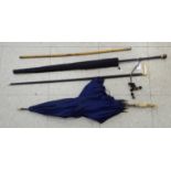 Walking sticks and parasols: to include a late Victorian blue fabric parasol with a carved bone