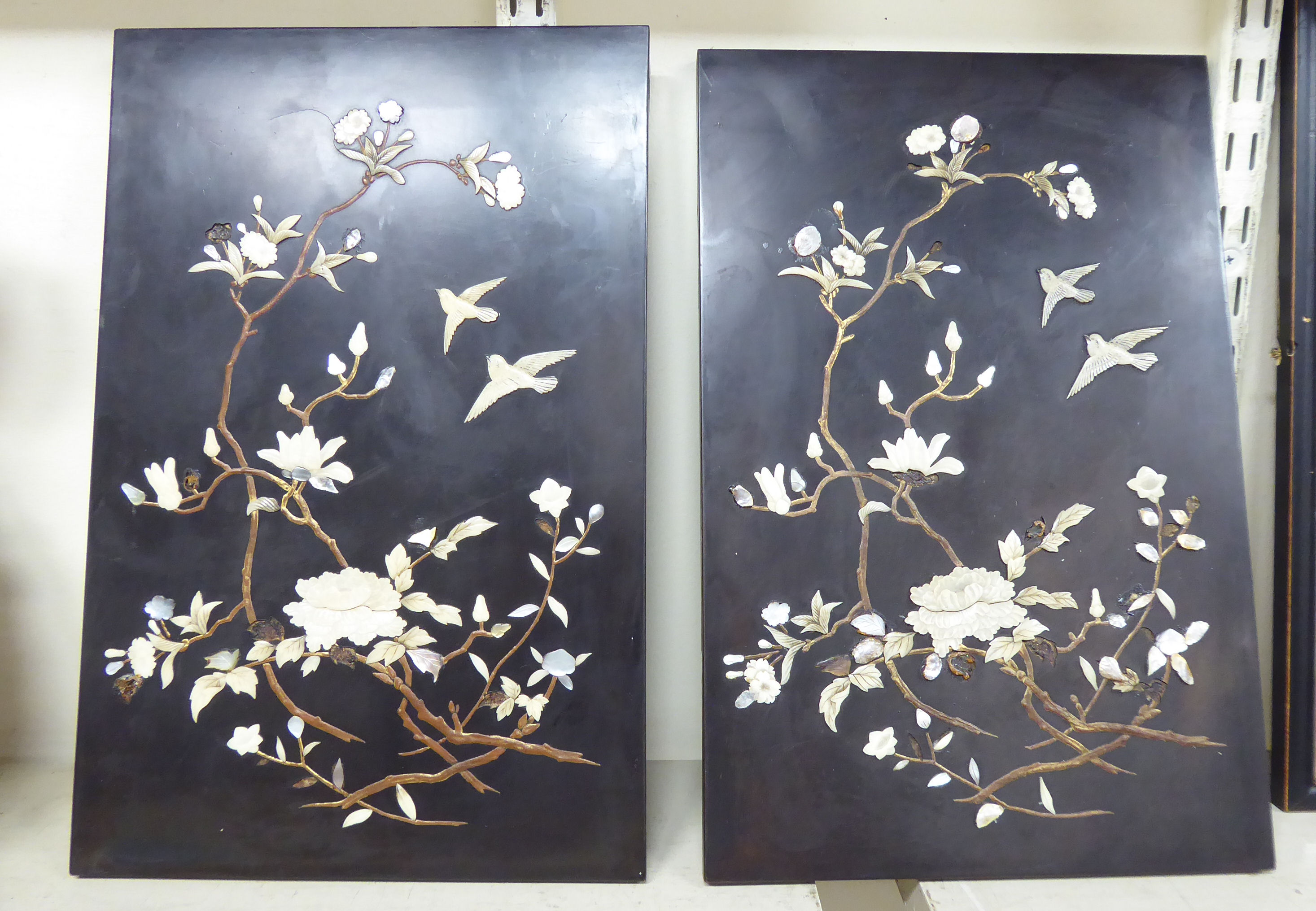 A pair of early 20thC Japanese black lacquered panels,