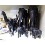 A graduated set of eight carved ebony model elephants largest 8.