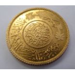 A Persian gold coin with a milled edge 11