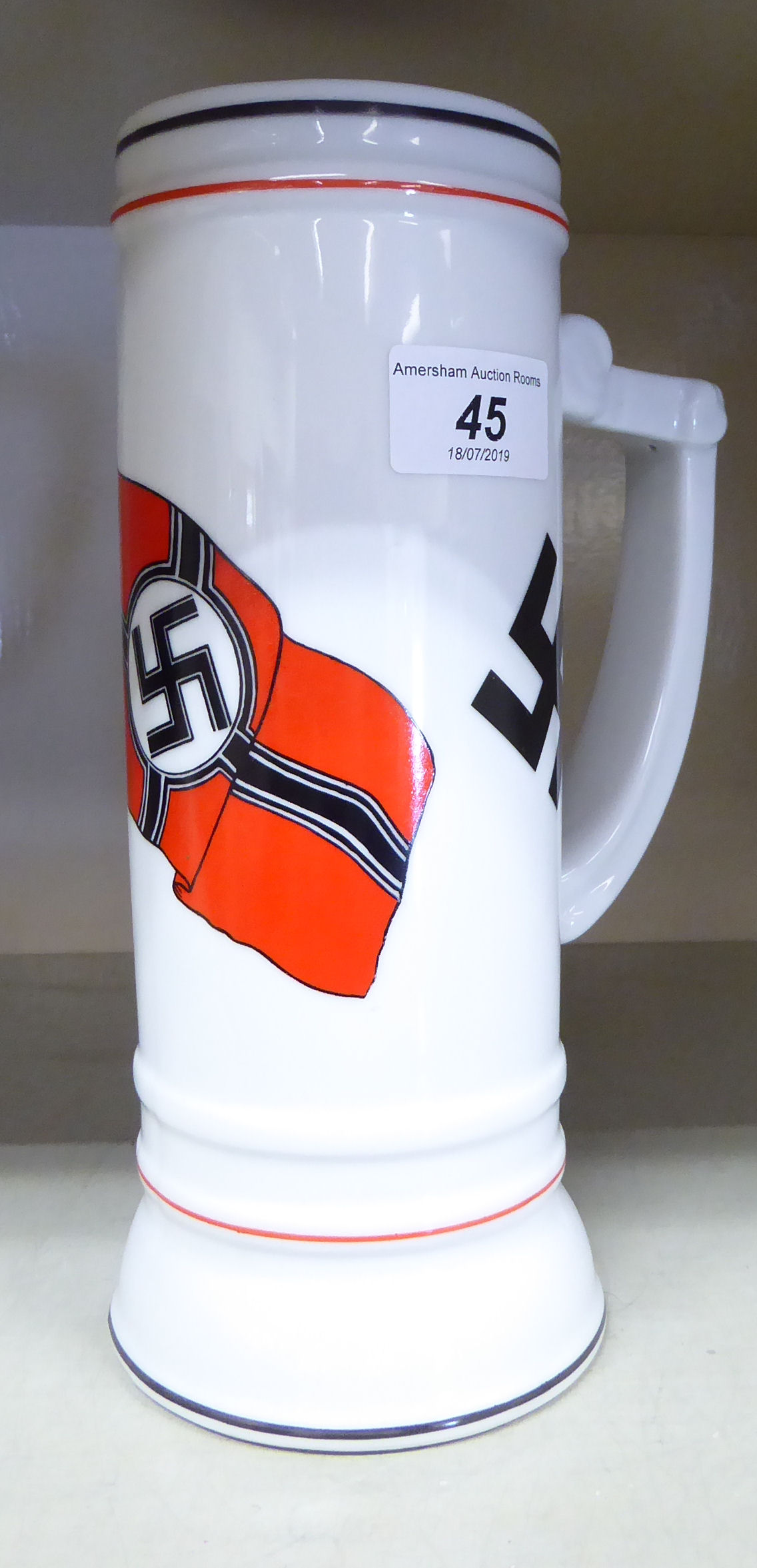 A German porcelain beer stein,