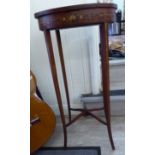 An Edwardian satinwood display table, overpainted with floral designs, the oval,