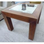 A modern stitched brown hide covered coffee table with an inset glass top,