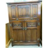 An Old Charm carved oak bureau with iron fittings,