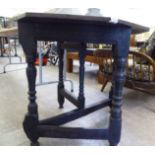 An 18thC and later country made carved, dark stained oak side table,