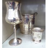 Silver plated ware, viz. a punch cup; a stemmed goblet; and a twin handled ice bucket 5.