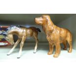 Two Beswick china models, viz. a standing brown spaniel 5.5''h; and a foal 4.