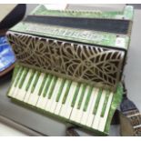 A Casali Verona mottled green cased piano accordian RAM