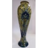 A Moorcroft pottery vase of slender, waisted baluster form,