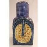 A Troika pottery square box design chimney vase, decorated in tones of blue,