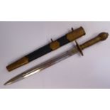 A German military dagger with a brass handle, pommel and hilt and opposing swastika emblems,