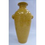 A 20th Century Chinese mustard coloured glazed porcelain vase of slender, baluster form,