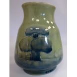 A Moorcroft pottery vase of tapered, bulbous form with a wide, flared neck,