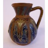 A Doulton Lambeth stoneware jug of bulbous form, having an angular loop handle,