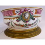 A late 19thC Samson porcelain bowl of shallow, demi-reeded moulded ogee form,