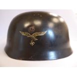 A German parachutist's helmet with a hide lining,