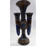 A Doulton Lambeth stoneware specimen vase of triple trumpet design, on a conical foot,