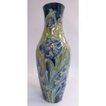 A Moorcroft pottery vase of baluster form with a wide neck and flared rim,