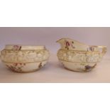 An early 20thC Royal Worcester china cream jug and matching sugar basin of shallow, squat,