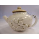 An early 18thC Chinese miniature blanc-de-chine teapot,