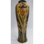 A Moorcroft pottery vase of slender baluster form,