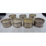 Seven variously decorated silver napkin rings mixed marks 11