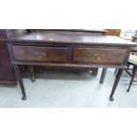 A George III oak serving table with two drawers,