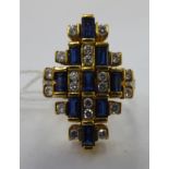 An 18ct gold diamond and sapphire cluster ring 11