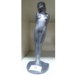 An Art Deco cast lead figure, a standing nude, on a plinth 7.