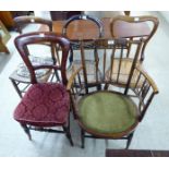 Five late Victorian chairs: to include a satinwood inlaid mahogany framed example with a spindled