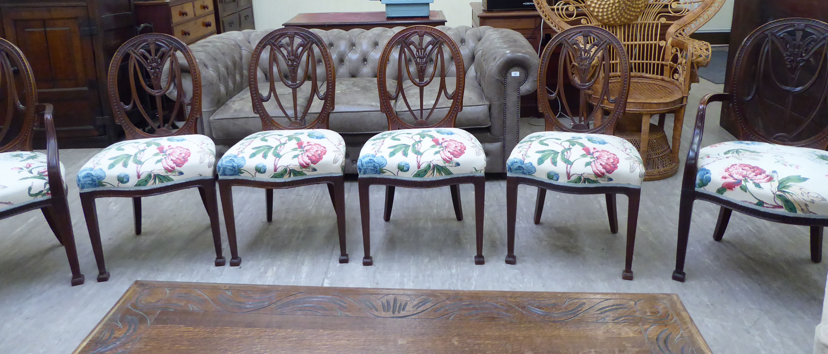 A set of six early 20thC Hepplewhite design mahogany framed dining chairs,