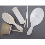 Late Victorian ivory backed dressing table items: to include a hand mirror and glove stretchers