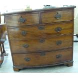 An early 19thC mahogany five drawer bow front dressing chest,