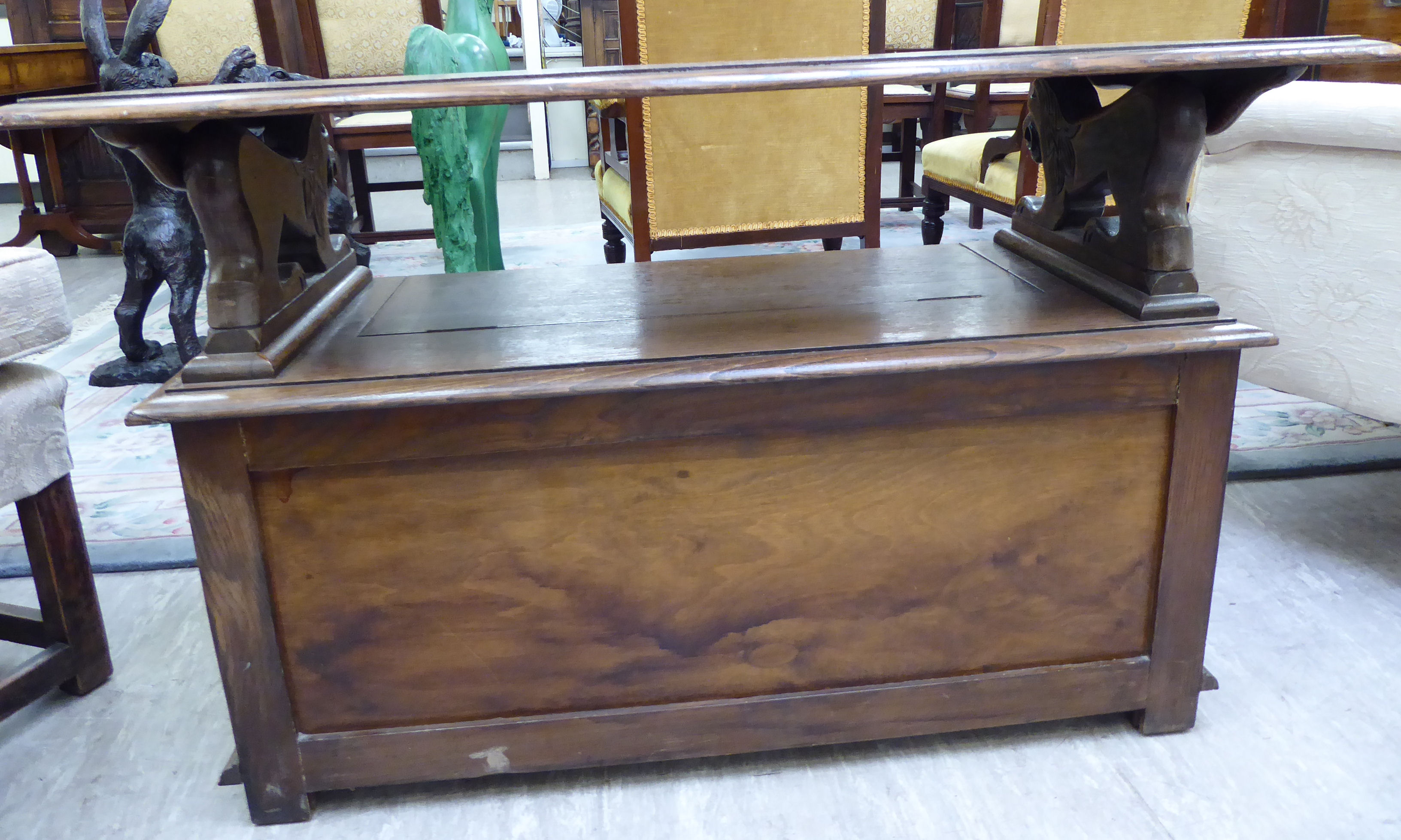 A 1920s/30s oak monk's bench with lion carved arms and a hinged seat, - Image 6 of 6