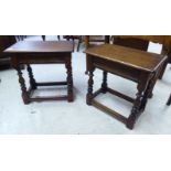 A pair of 19thC design oak framed joint stools with reed moulded aprons, raised on ring turned legs,