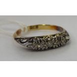 An 18ct gold six stone diamond ring 11