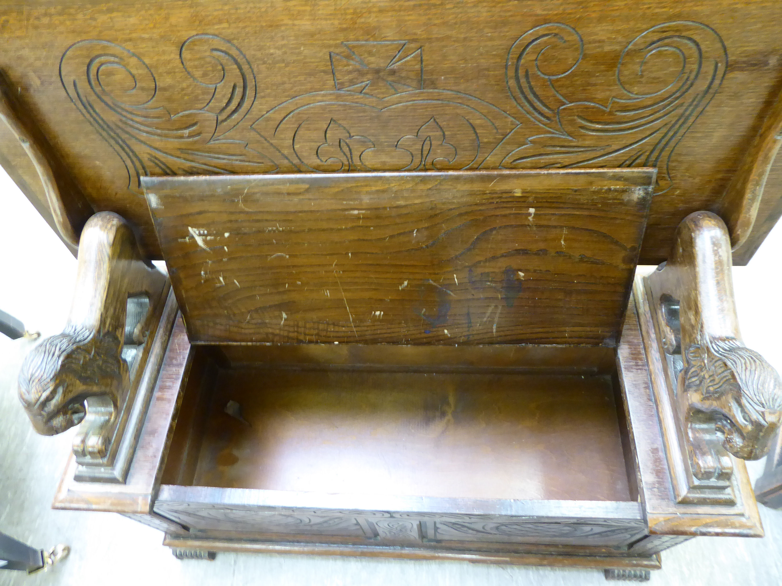 A 1920s/30s oak monk's bench with lion carved arms and a hinged seat, - Image 3 of 6